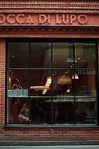 Picture of the entrance of restaurant Bocca Di Lupo with owner Jacob Kenedy